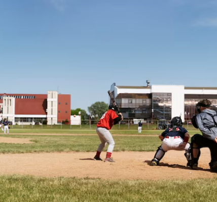 Side view of kids playing baseball outdoors