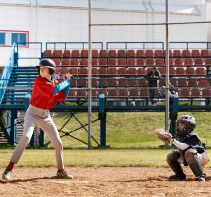 A youth baseball player ready to hit in a game