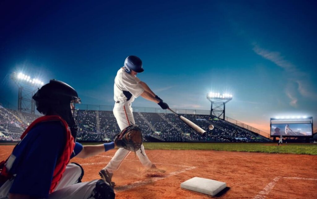 Batter hits ball with catcher and umpire behind him