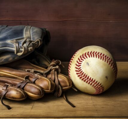 Close up of baseball with glove