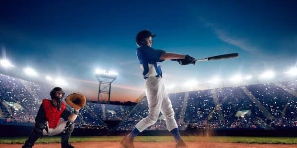 Two men on the field playing baseball with a bat