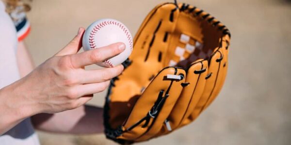 Woman Holding Baseball Glove and Ball